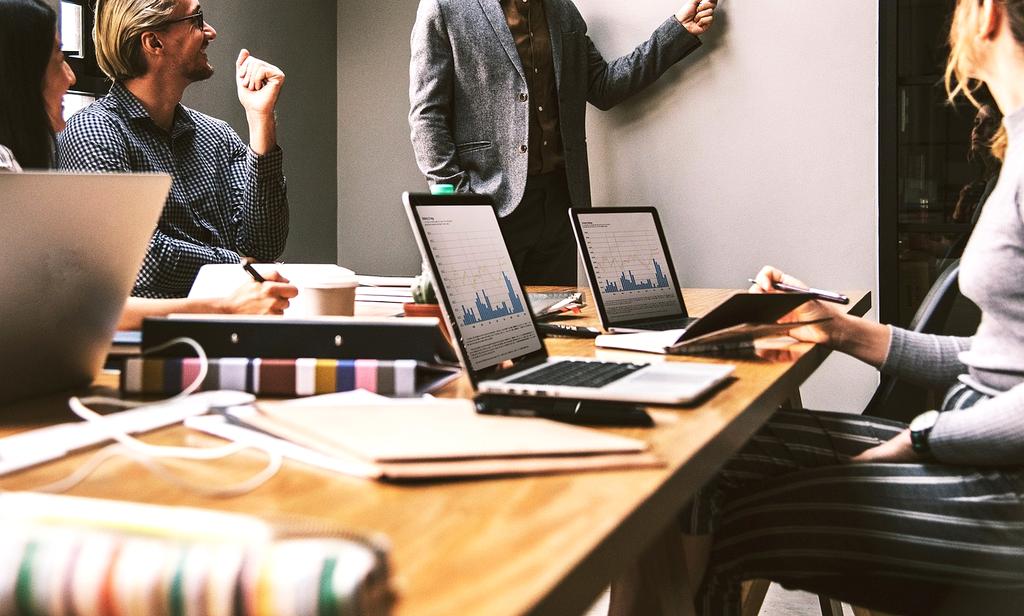 Team of BRANDNAME productivity experts collaborating in modern office